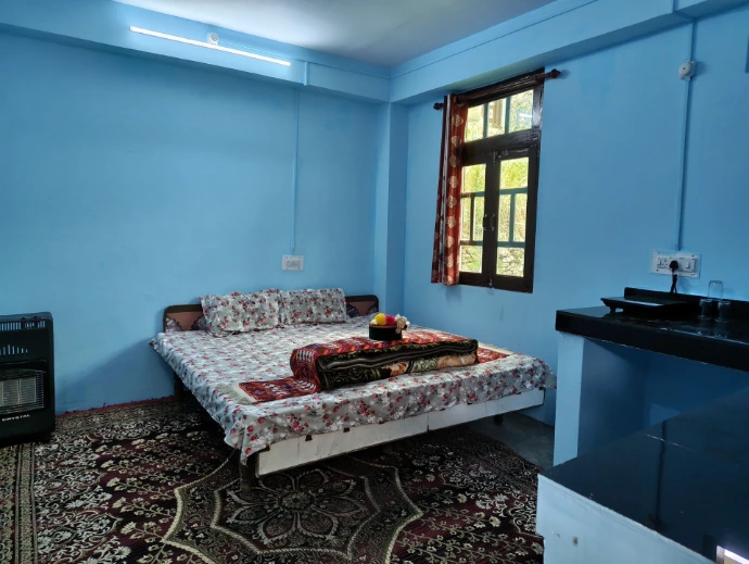 Mountain homestay bedroom in Shudarang, Kinnaur, Himachal Pradesh